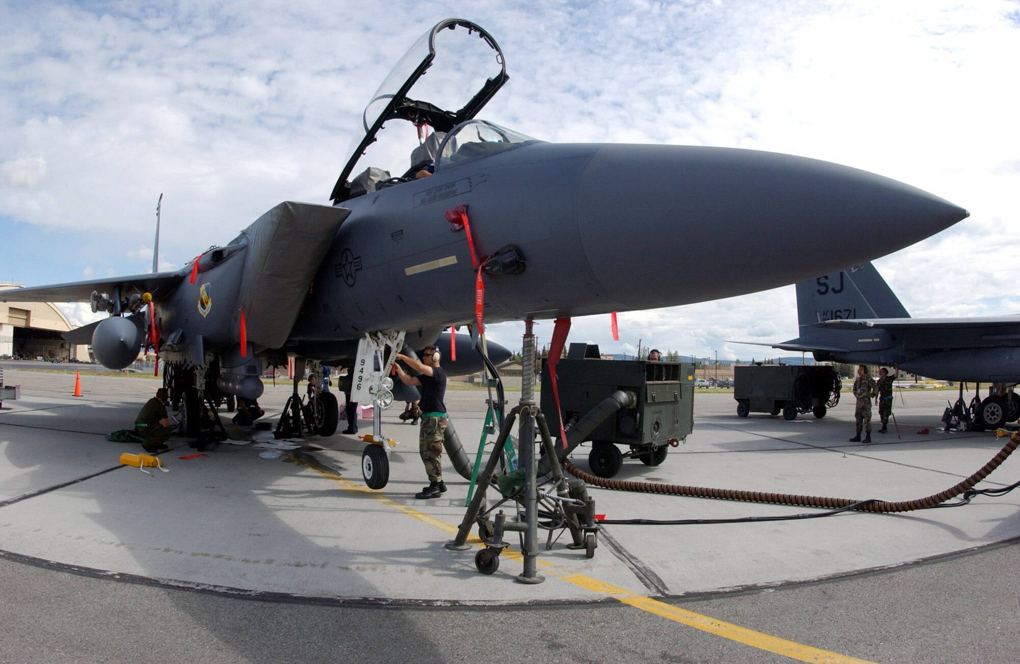 Maintainers from the 335th Aircraft Maintenance Unit at Seymour Johnson Air Force Base, N.C., perform a "jack-retract" during a maintenance check July 12 on an F-15E Strike Eagle that is participating in Red Flag-Alaska 2007 at Eielson Air Force Base, Alaska.  Red Flag-Alaska is a Pacific Air Forces-directed field training exercise for U.S. and coalition forces flown under simulated air-combat conditions.  (U.S. Air Force photo/Airman 1st Class Jonathan Snyder)