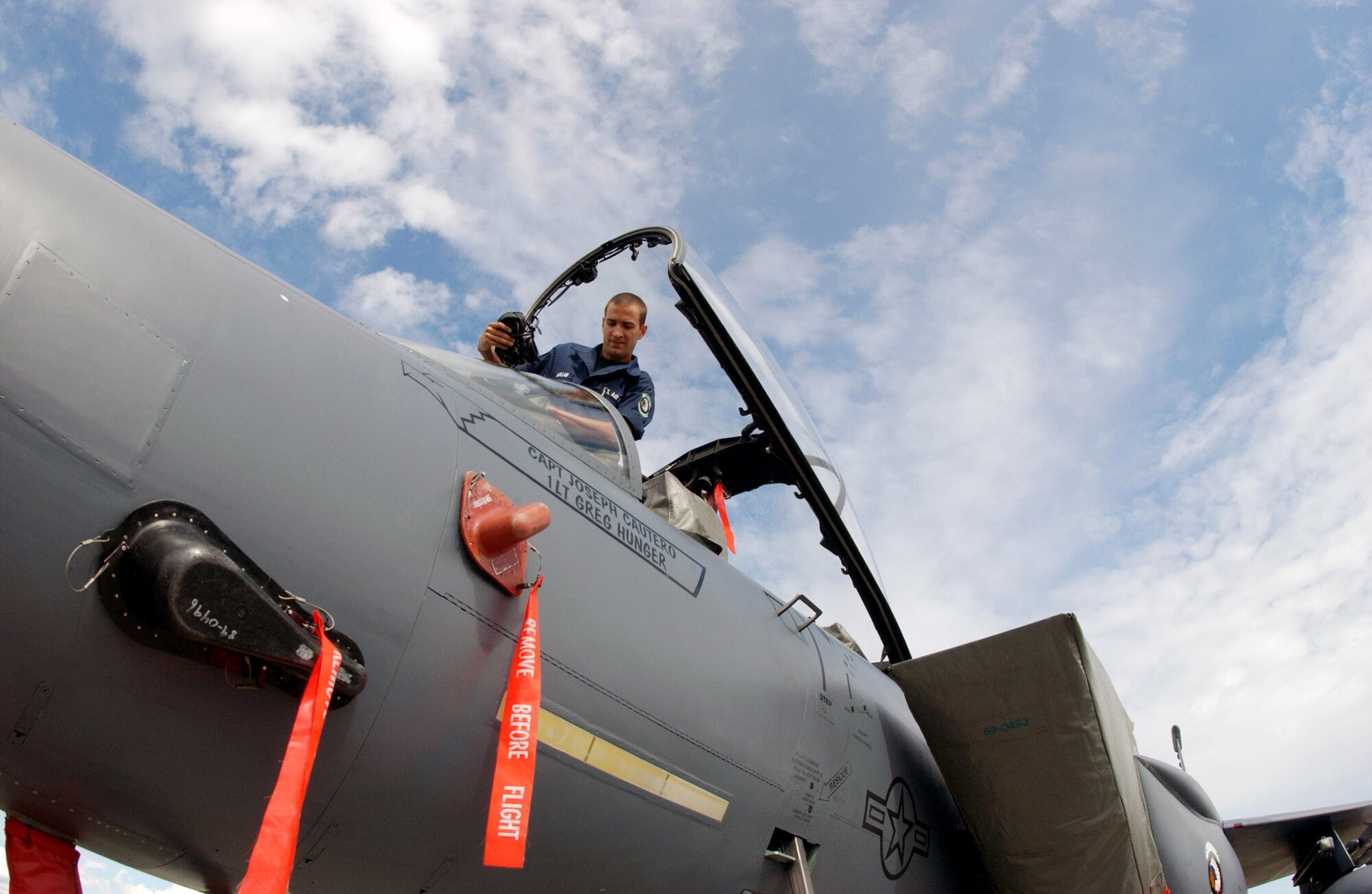Airman 1st Class Harrison McMillan climbs into the cockpit as he and other maintainers toubleshoot the landing gear on an F-15E Strike Eagle July 12 that is participating in Red Flag-Alaska 2007 at Eielson Air Force Base, Alaska.  Red Flag-Alaska 07-3 is a Pacific Air Forces-directed field training exercise for U.S. and coalition forces flown under simulated air-combat conditions.  Airman McMillan is assigned to the 335th Aircraft Maintenance Unit at Seymour Johnson AFB, N.C.  (U.S. Air Force photo/Airman 1st Class Jonathan Snyder)
