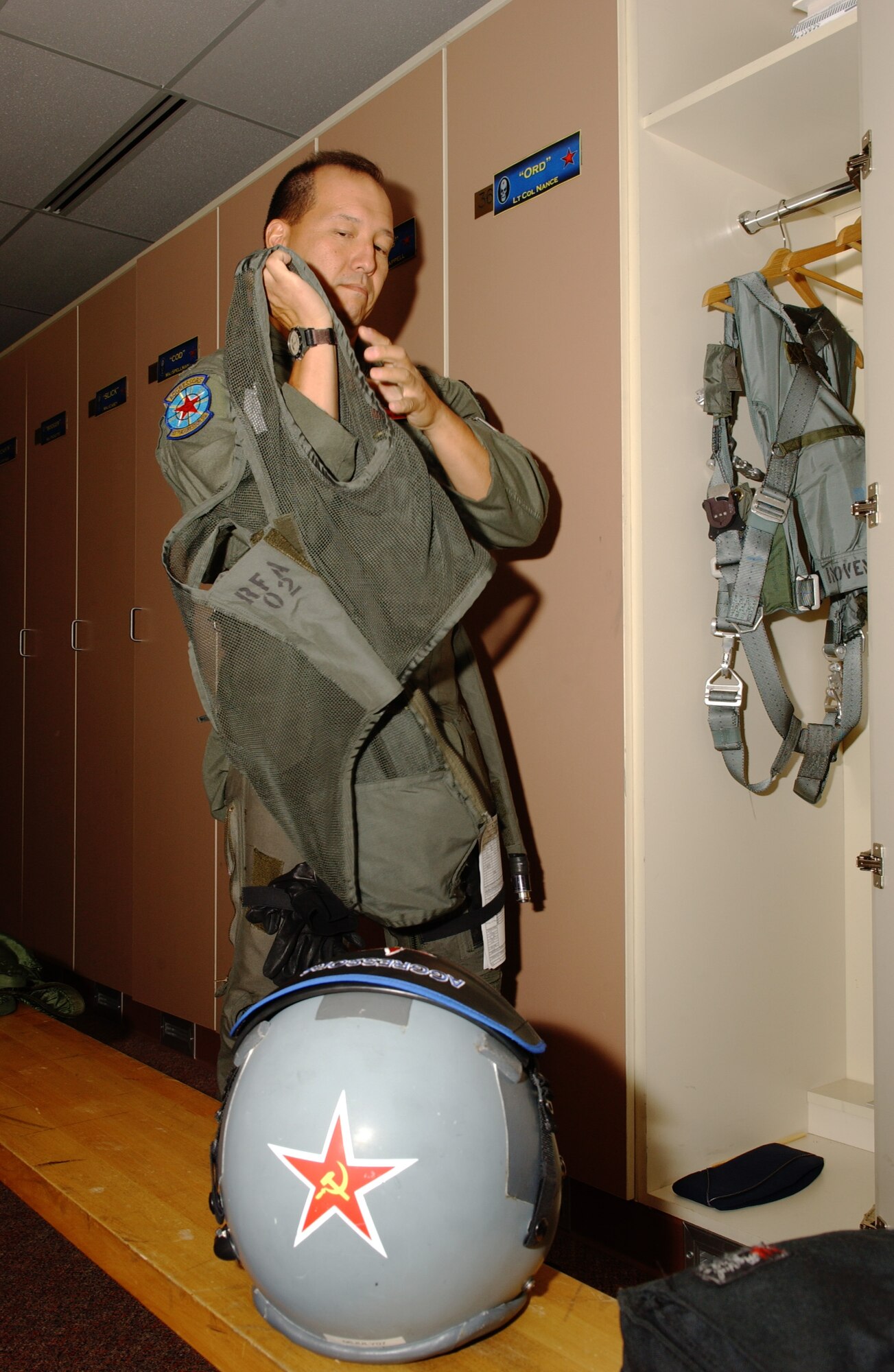EIELSON AIR FORCE BASE, Alaska -- Lt. Col. Tom Bouley, 65th Fighter Squadron, Nellis AFB, suits up and gets ready to step to his F-15 Strike Eagle on July 13. Red Flag-Alaska enables aviation units to sharpen their combat skills by flying ten simulated combat sorties in a realistic threat environment. Additionally, the training allows them to exchange tactics, techniques, and procedures and improve interoperability. (U.S. Air Force Photo by Airman 1st Class Jonathan Snyder)
