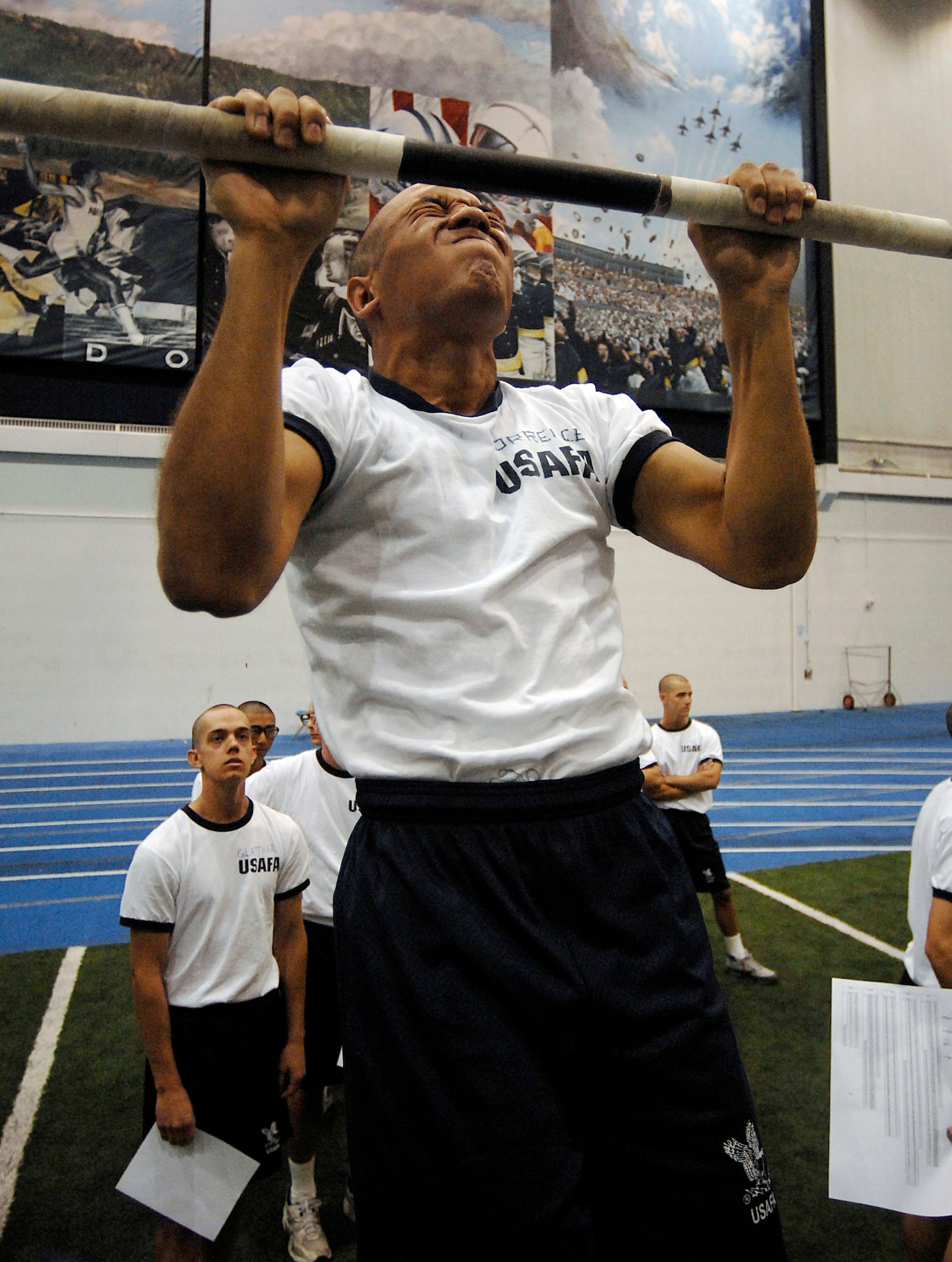Cadet Matthew Torrence tries for one last pull up during his physical fitness test July 12 at the U.S. Air Force Academy, Colo. Males need 21 pull ups to receive maximum points. The Academy received 9,162 application for this year's class in which only 1,600 were offered appointments. These first-year cadets receive basic discipline and skills to help develop them into officers. (U.S. Air Force photo/Tech. Sgt. Larry A. Simmons)