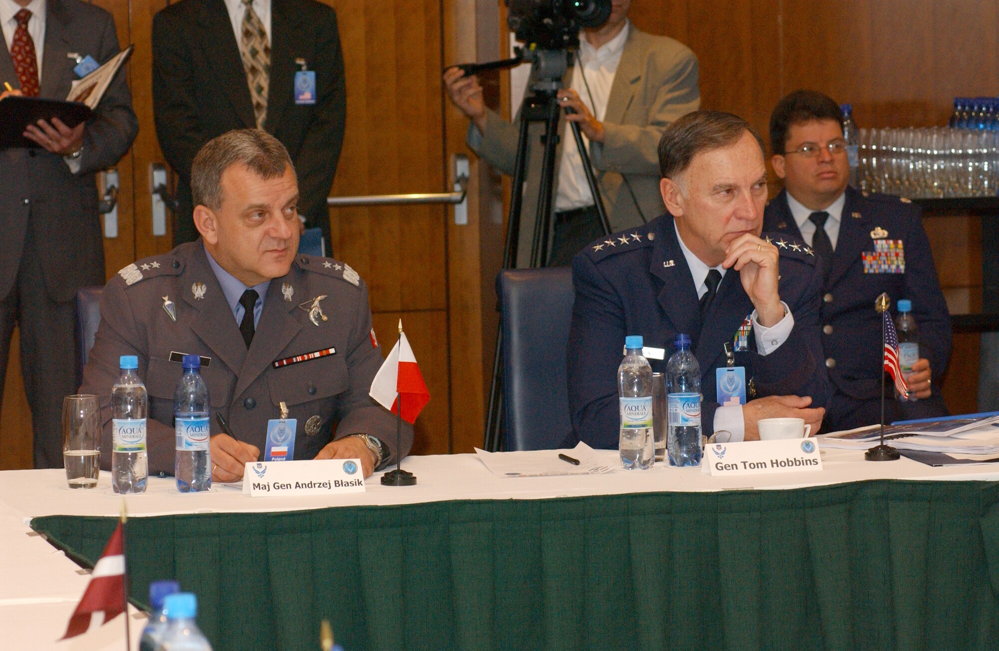 U.S. Air Forces in Europe Commander Gen. Tom Hobbins (right) and Maj. Gen. Andrzej Blasik, Polish Air Force Commander, listen intently as war game planners explain scenarios to delegations from 10 different NATO countries during the Building Partnership Event, Unified Engagement Poland Seminar, a war game event designed to explore joint warfighting concepts and capabilities. (U.S. Air Force photo/Tech. Sgt. Chris Stone)