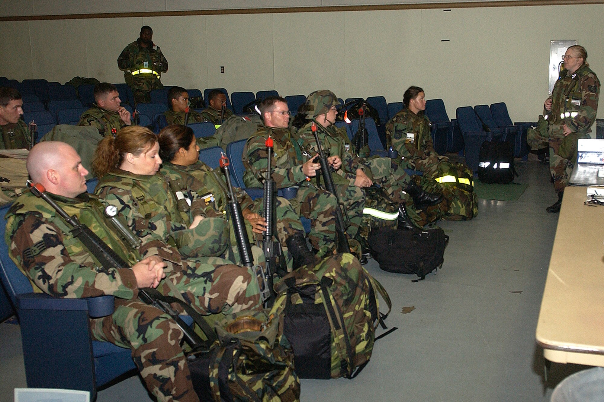 Airmen from across the 8th Fighter Wing receive a deployment briefing before departing the base during Wolf War Days on July 16, 2007. Wolf War Days prepare airmen for upcoming peninsula wide exercise next week. (U.S. Air Force photo by Senior Airman Giang Nguyen)    