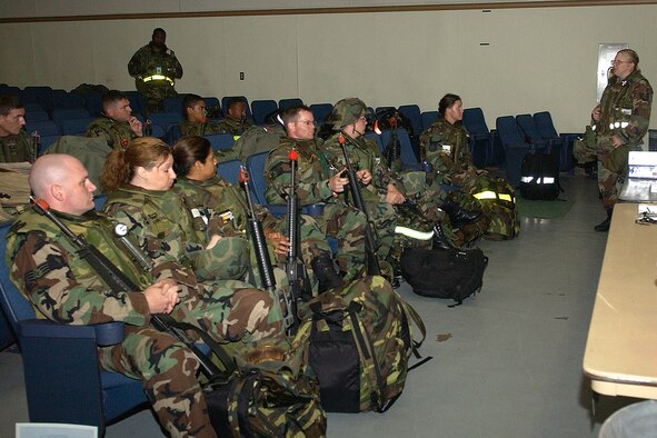 Airmen from across the 8th Fighter Wing receive a deployment briefing before departing the base during Wolf War Days on July 16, 2007. Wolf War Days prepare Airmen for an upcoming peninsula wide exercise next week. (U.S. Air Force photo by Senior Airman Giang Nguyen) 
