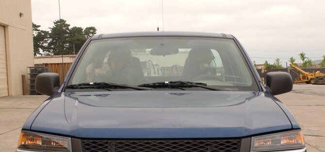 Tech. Sgt. Troy D'Angelo (left) trains Airman 1st Class Justin Gatter on the proper procedures to operate a vehicle while wearing chemical warfare gear during Wolf War Days on July 16. The two-day exercise prepares 8th Fighter Wing Airmen for the upcoming Korean peninsula exercise next week along with potential real world scenarios. Both Airmen are assigned to the 8th Civil Engineer Squadron. (U.S. Air Force Photo/Senior Airman Steven R. Doty)