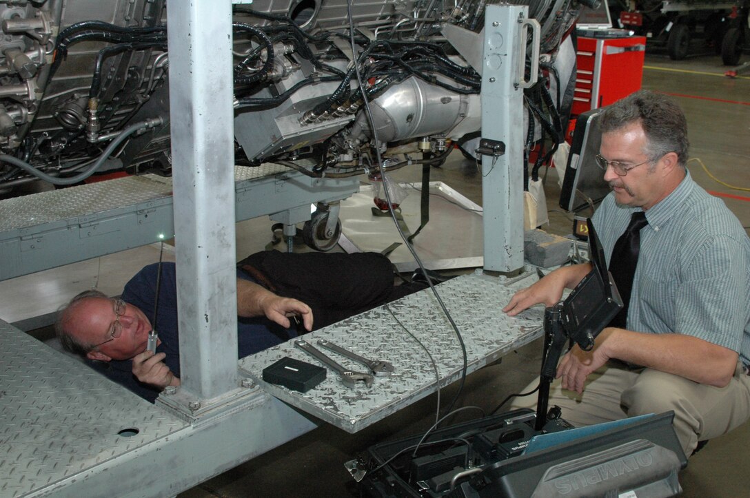 Albert Weatherbee (left), 28th Maintenance Group Air Force Engineering and Technical Services is having his work inspected by Scott McKnight (right) Dyess Air Force Base 7th MXG AFETS propulsion specialist. "Mr. Weatherbee is currently a highly proficient airframe systems technician,” said Lanny Harris, 28th MXG temporary lead.  “After testing into propulsion systems, Mr. Weatherbee is dual qualified and is the first AFETS technician to be recognized as a super technician.” 
<br><br>
Mike Daniel, headquarters Air Combat Command general electric propulsion specialist performed the oral testing portion of the inspection of Mr. Weatherbee's knowledge of the B-1 propulsion system and said that he was very pleased with Mr. Weatherbee's demonstrated knowledge of the B-1B propulsion system and that the evaluation went extremely well. 
<br><br>
The Super Tech Program provides a valuable product by enabling the Air Force to reduce its deployed footprint utilizing General Schedule-12 AFETS with a wide skill set. This program provides an opportunity for GS-11 team members to earn promotion to GS-12 by gaining these additional skills and assuming added responsibilities.
