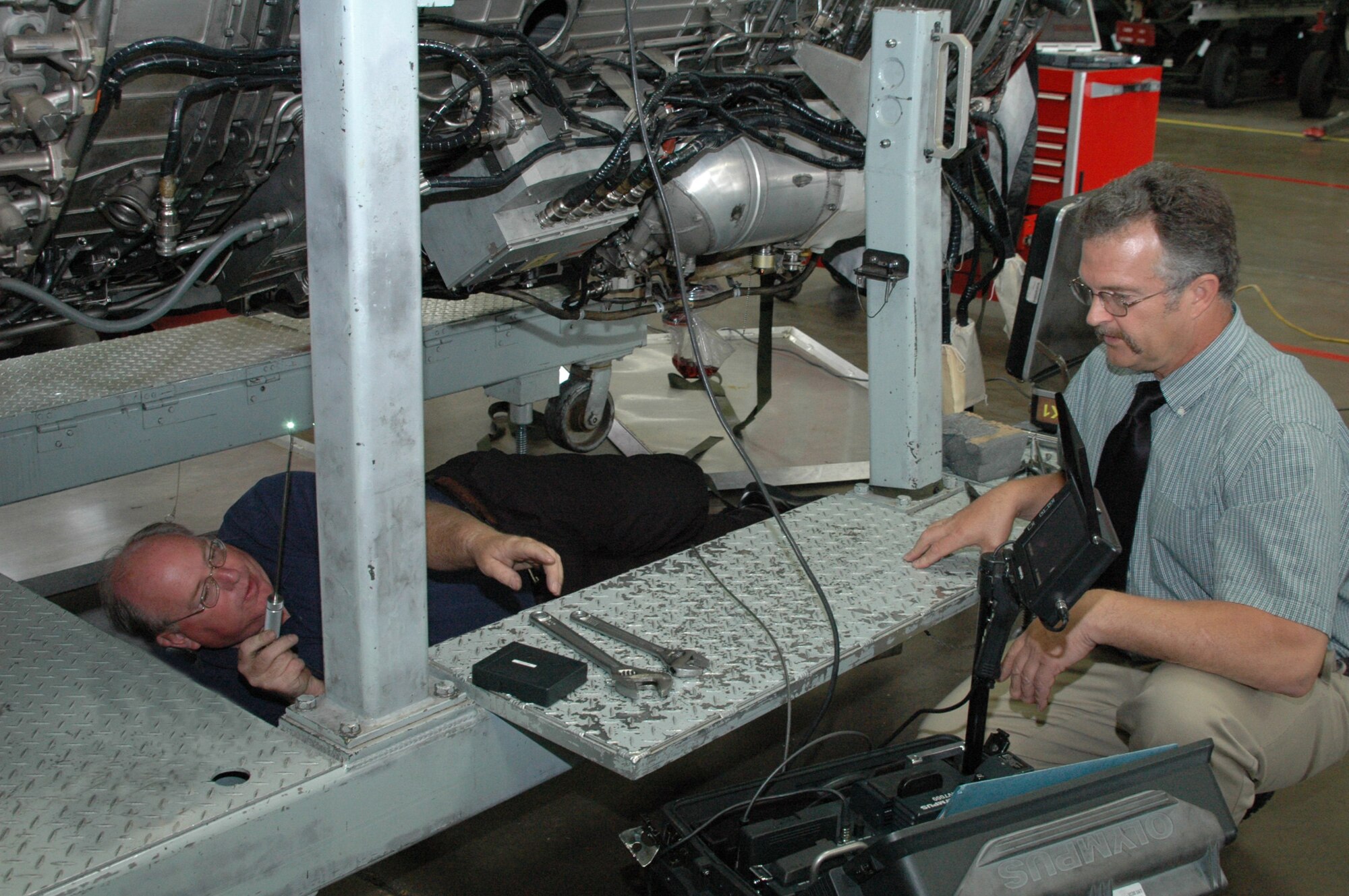 Albert Weatherbee (left), 28th Maintenance Group Air Force Engineering and Technical Services is having his work inspected by Scott McKnight (right) Dyess Air Force Base 7th MXG AFETS propulsion specialist. "Mr. Weatherbee is currently a highly proficient airframe systems technician,” said Lanny Harris, 28th MXG temporary lead.  “After testing into propulsion systems, Mr. Weatherbee is dual qualified and is the first AFETS technician to be recognized as a super technician.” 
<br><br>
Mike Daniel, headquarters Air Combat Command general electric propulsion specialist performed the oral testing portion of the inspection of Mr. Weatherbee's knowledge of the B-1 propulsion system and said that he was very pleased with Mr. Weatherbee's demonstrated knowledge of the B-1B propulsion system and that the evaluation went extremely well. 
<br><br>
The Super Tech Program provides a valuable product by enabling the Air Force to reduce its deployed footprint utilizing General Schedule-12 AFETS with a wide skill set. This program provides an opportunity for GS-11 team members to earn promotion to GS-12 by gaining these additional skills and assuming added responsibilities.
