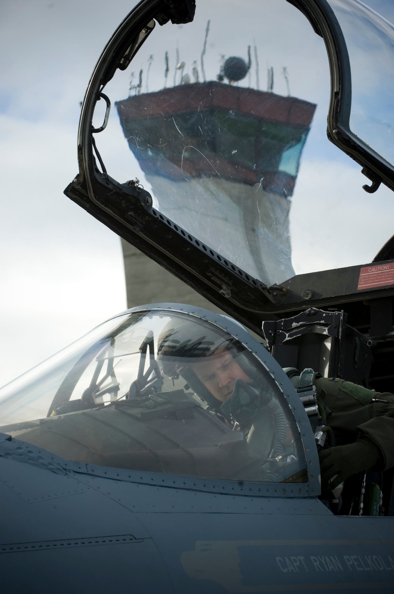Capt. Tim Bobinski, a 12th Fighter Squadron pilot, completes final checks before a training sortie in an F-15C over Alaska's ranges. (U.S. Air Force photo by Senior Airman Garrett Hothan)
