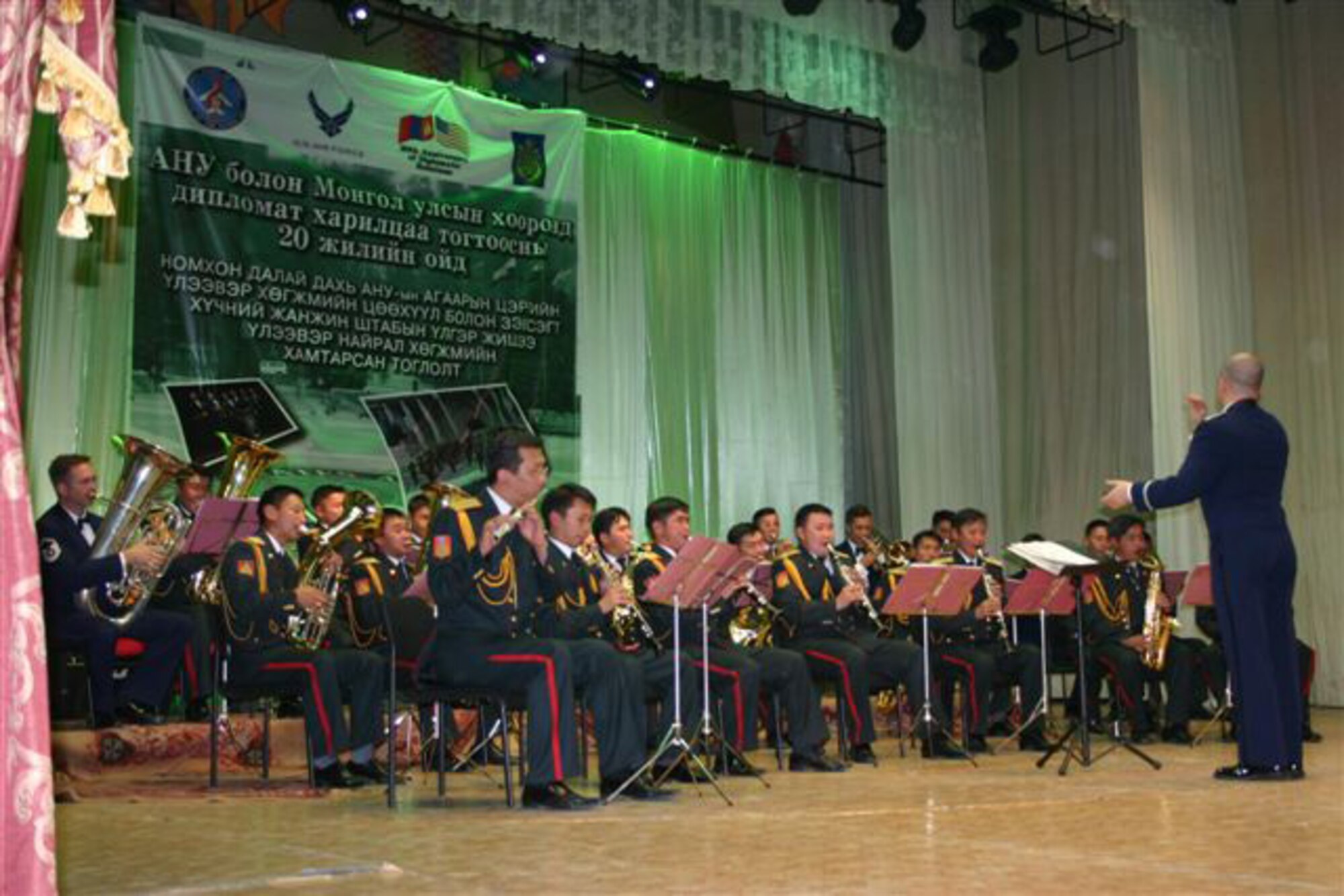 ERDENET, Mongolia – Maj. Matt Henry, commander of the USAF Band of the Pacific-Asia conducts the combined band in Erdenet June 28. (Courtesy USAF photo)