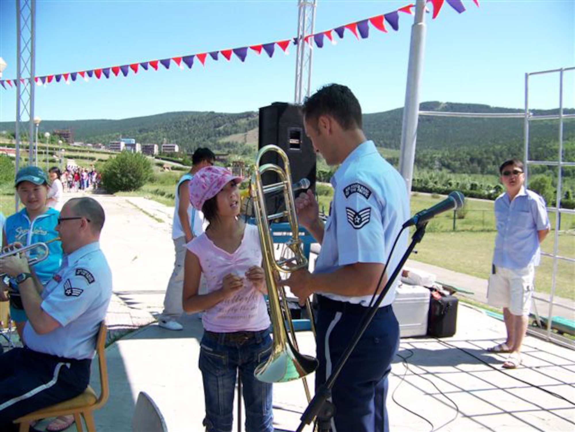 ULAANBATAAR, Mongolia -- The USAF Band of the Pacific-Asia interacts with students at the International Children's Centre "Nairamdal" (youth camp) July 4.