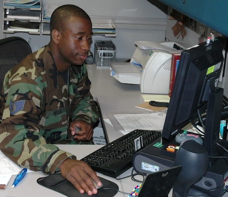 VANDENBERG AIR FORCE BASE, Calif. -- Staff SSgt. Travis Heath reviews physicals to make sure Airmen are fit to serve. The Public Health Flight was able to approve 500 Airmen to deploy around the world in 2006. (U.S. Air Force photo/Airman 1st Class Wesley Carter)   