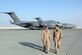 Capt. Corbett Bufton, 816 Expeditionary Airlift Squadron C-17 aircraft commander (right), walks with Airman Methvan, 816 EAS loadmaster, on the flightline in Southwest Asia. The crew of the C-17 flight to save Soldiers in Iraq, otherwise known as the "RED 7," Captains Bufton, Scott Frechette and Justin Herbst, Staff Sgt. Matt Nemeth, Senior Airman David Methvan and Lt. Col. Jesse Strickland, all based out of Charleston AFB. (U.S. Air Force photo/Capt. Teresa Sullivan)