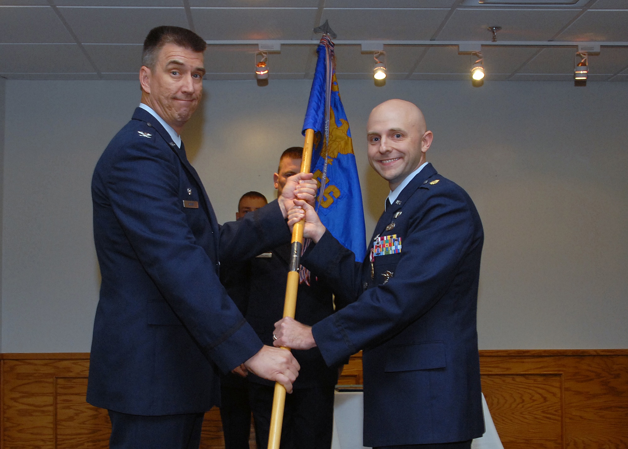 Col. Steven McKay, 82nd Mission Support Group commander, accepts the guidon from outgoing 82nd Security Forces Commander Maj. Greg Nowak at the 82nd SFS change-of-command ceremony July 16. (U.S. Air Force photo/Mike Litteken )