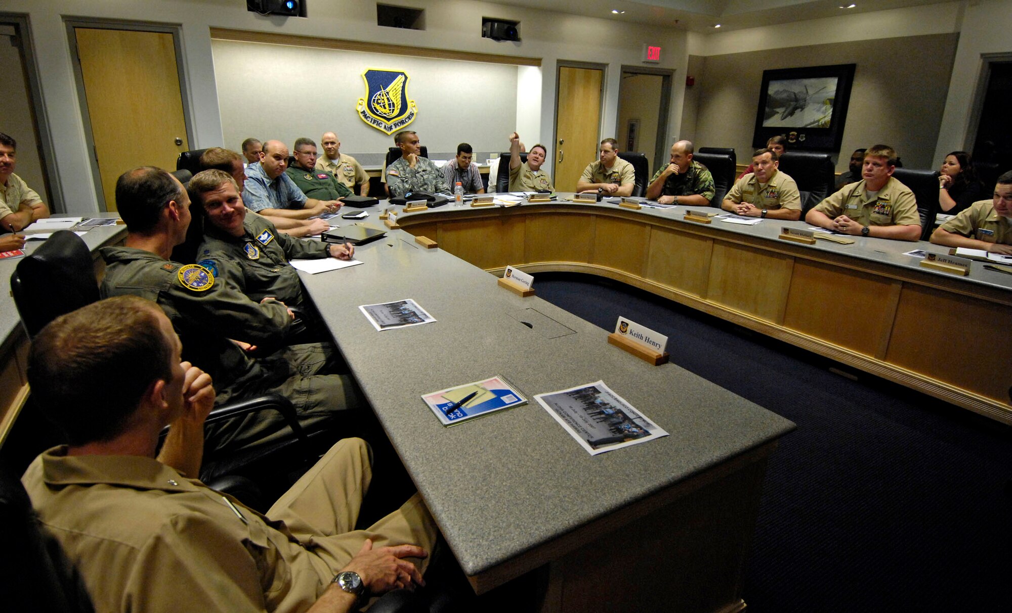 Members of the Joint Interface Control Officer Conference discuss standardized guidance and procedures July 16 at Hickam Air Force Base, Hawaii. The conference is a four-day event involving joint interface control officers and ballistic missile defense experts from across the Pacific Command to focus on integrating assets and capabilities to form a stronger alliance and interoperability for the future. (U.S. Air Force photo/Tech. Sgt. Shane A. Cuomo) 
