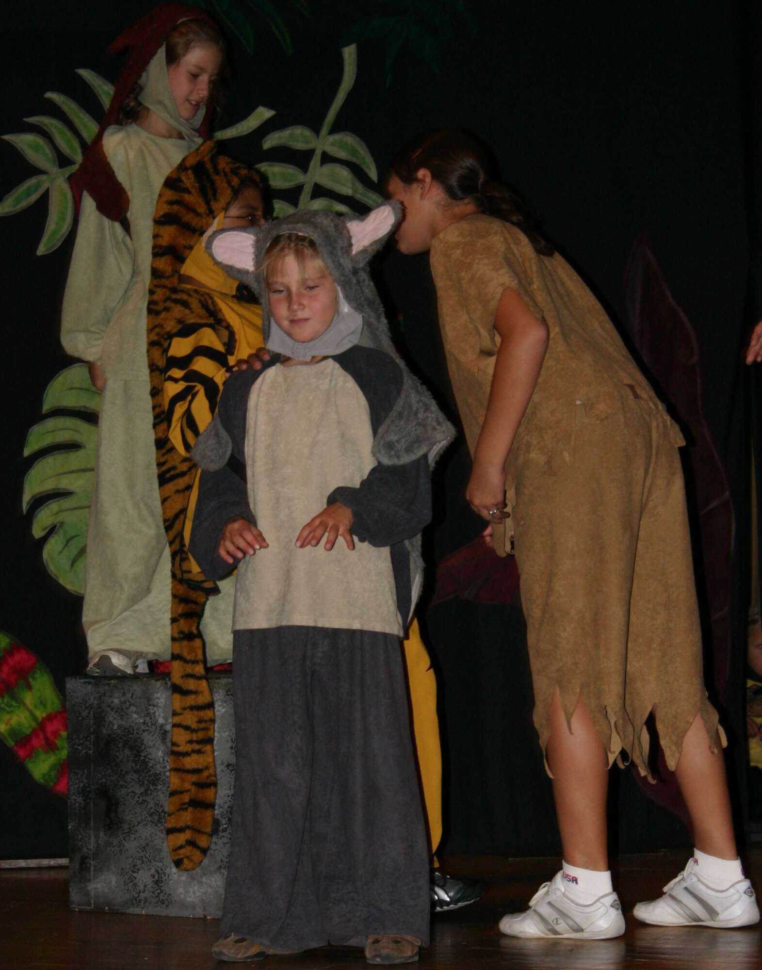 From left to right: Rachel Pata, Patricia Romero, Alison Brewer and Gloria Trujillo perform a scene from "The Jungle Book" during a dress rehearsal. The Missoula Children's Theatre presented the play at the base theater here July 14.(U.S. Air Force photo by Airman Elliott Sprehe)