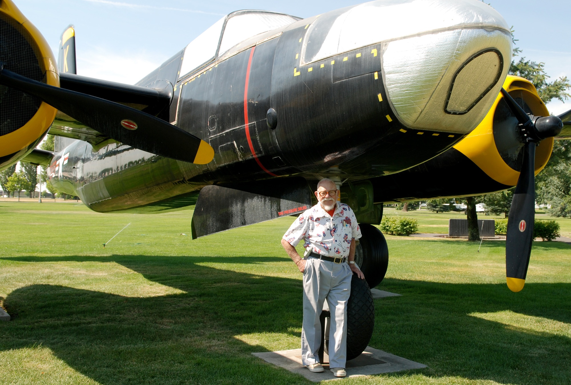 FAIRCHILD AIR FORCE BASE, Wash. – Propped against the landing gear of a Douglas A-26 Invader, retired Maj. Malcolm A. Stewart reflects on his time in the sky over England in this type of aircraft. Major Stewart served during World War II from September 1943 to December 1945 flying various fighter and transport aircraft, to include the P-51 Mustang and the Douglas C-47 Skytrain. (U.S. Air Force Photo/ Tech. Sgt. Larry W. Carpenter Jr.) 