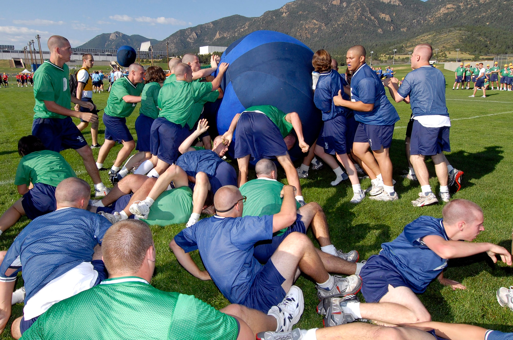 Basic cadet trainees play push ball during Field Day July 14 at the U.S. Air Force Academy in Colorado. Push ball is a highly charged contest where cadets push a large sphere across a goal line. New cadets are in their first month of training at the Academy and are learning honor, discipline and integrity in addition to physical fitness. (U.S. Air Force photo/Mike Kaplan) 
