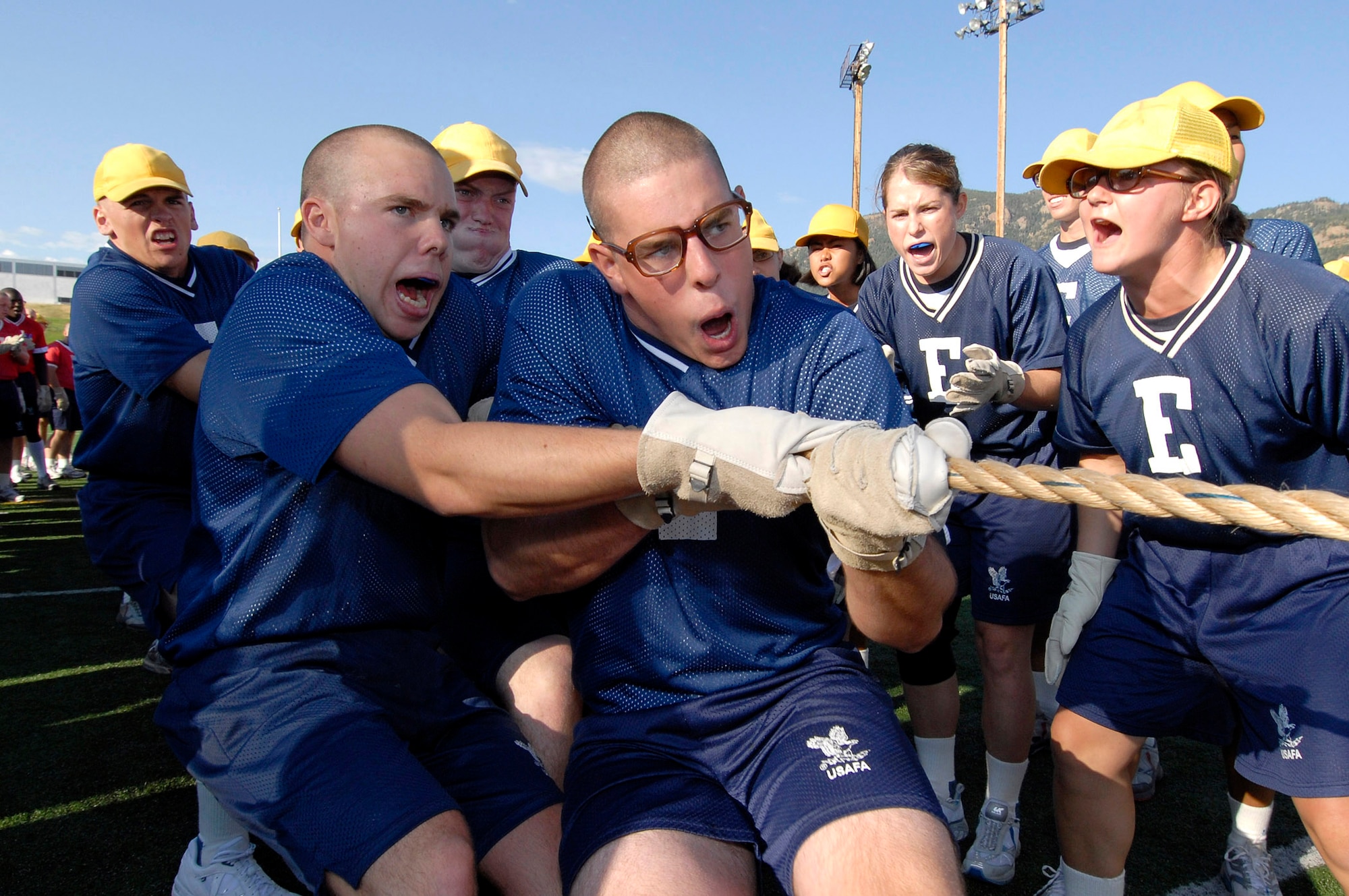 Basic Cadet Trainee Daniel Whittingham of Nashville, Tenn., leads his team during a tug-of-war contest at Field Day July 14 at the U.S. Air Force Academy in Colorado. New cadets are in their first month of training at the Academy and are learning honor, discipline and integrity in addition to physical fitness. (U.S. Air Force photo/Mike Kaplan)

