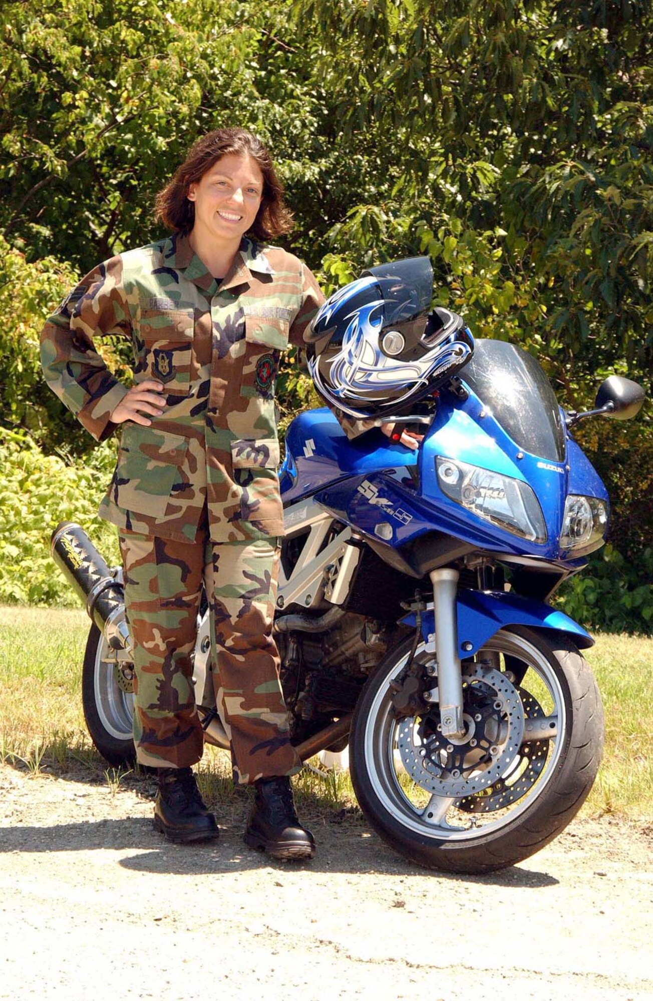ANDREWS AIR FORCE BASE, Md. - Senior Airman Melissa Barber, 459th Aeromedical Evacuation Squadron technician, poses for a photo with her Suzuki SV 650-S. (U.S. Air Force photo/Airman Ashley Crawford)