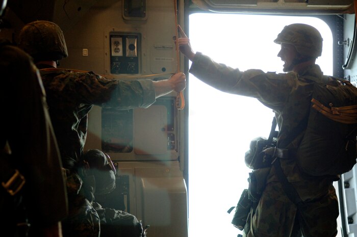 Australian Army Capt. Stuart Ware, chief officer for aerial delivery systems unit, Sydney Australia, Raaf Base Richmond counts down before parachutists from the U.S. Marines, Australian Army and U.S. Air Force parachute from a Charleston C-17 Globemaster III during a joint service airdrop training exercise July 12, 2007. (U.S. Air Force Photo/Airman 1st Class Nicholas Pilch)