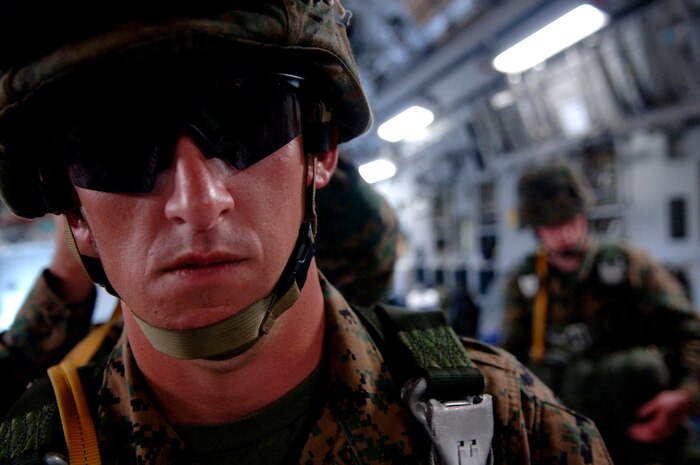U.S. Marine Corps 1st Lt. David McGrath, Officer in Charge of the 2nd Air Delivery Unit out of Camp Lejeune, N.C., dons his parachute for a joint service airdrop training exercise July 12, 2007 at Charleston AFB, S.C. (U.S. Air Force Photo/Airman 1st Class Nicholas Pilch)