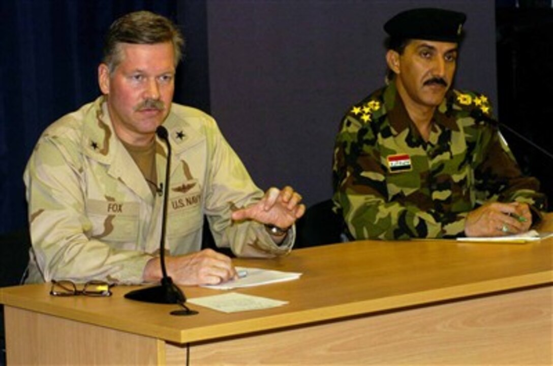 U.S. Navy Rear Adm. Mark I. Fox (left), a Multi-National Force-Iraq spokesman, and Iraqi Army Brig. Gen. Qassim Atta Al-Moussawi, Fardh Al-Qanoon spokesman, held a press conference on the progress of Iraqi Security Forces July 15. 