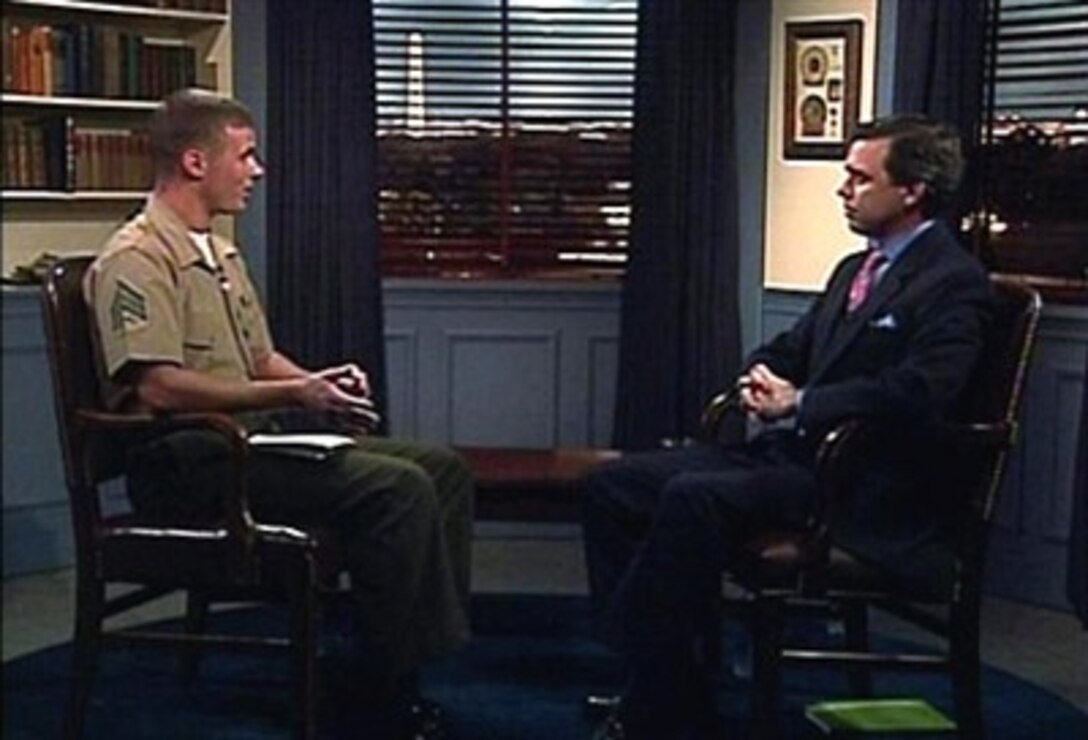 Geoff Morrell (right), the Pentagon's new press secretary, talks with a Pentagon Channel reporter about what the public can expect from him as he steps up to the podium. Morrell is a former White House correspondent for ABC news.    