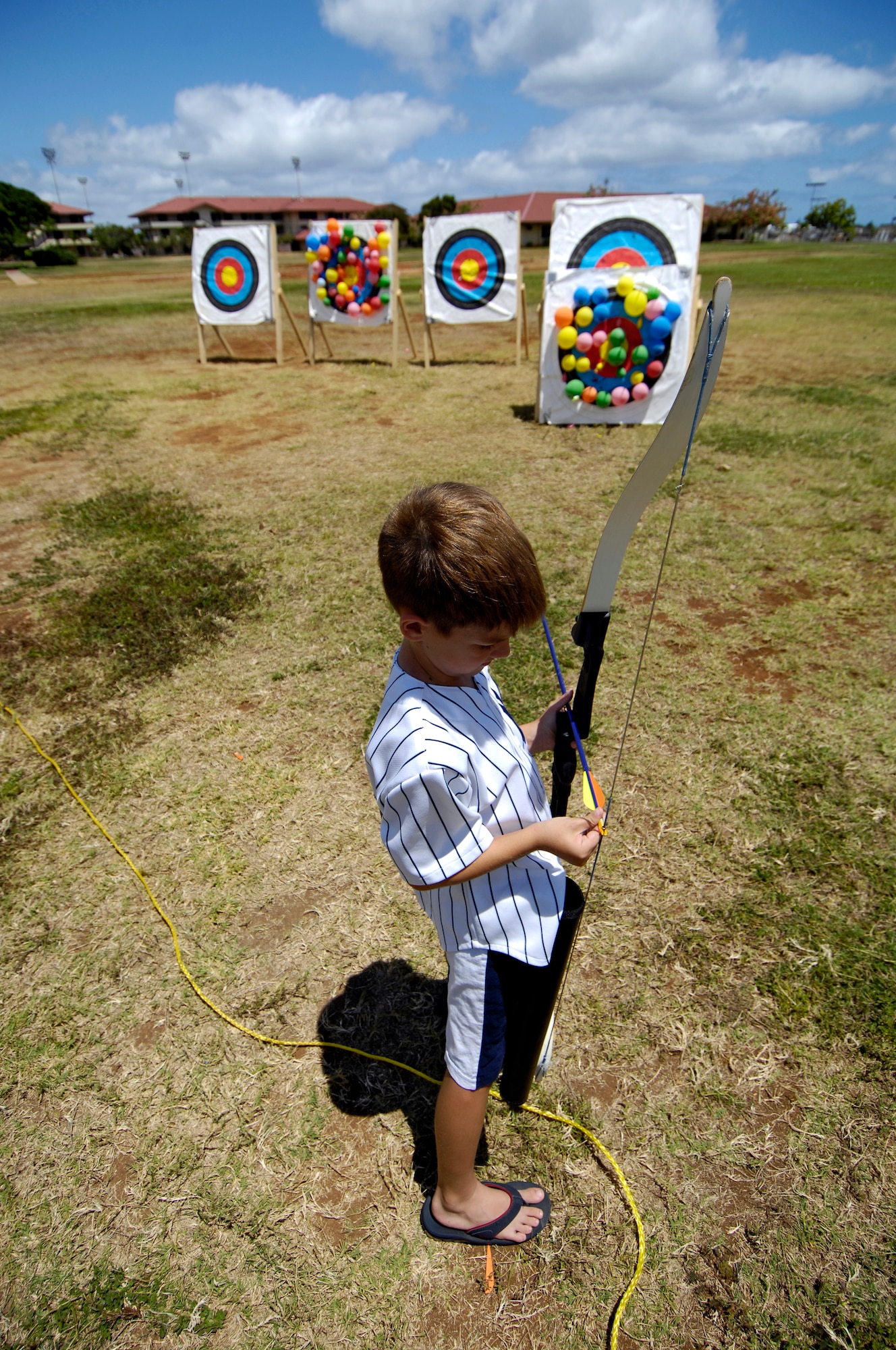 Andrew Setka, 8, fits an arrow into his bow during archery lessons at the Community Activity Center.  Andrew is the son of Maj. Dominic Setka. (U.S. Air Force photo/Tech. Sgt. Shane A. Cuomo)

