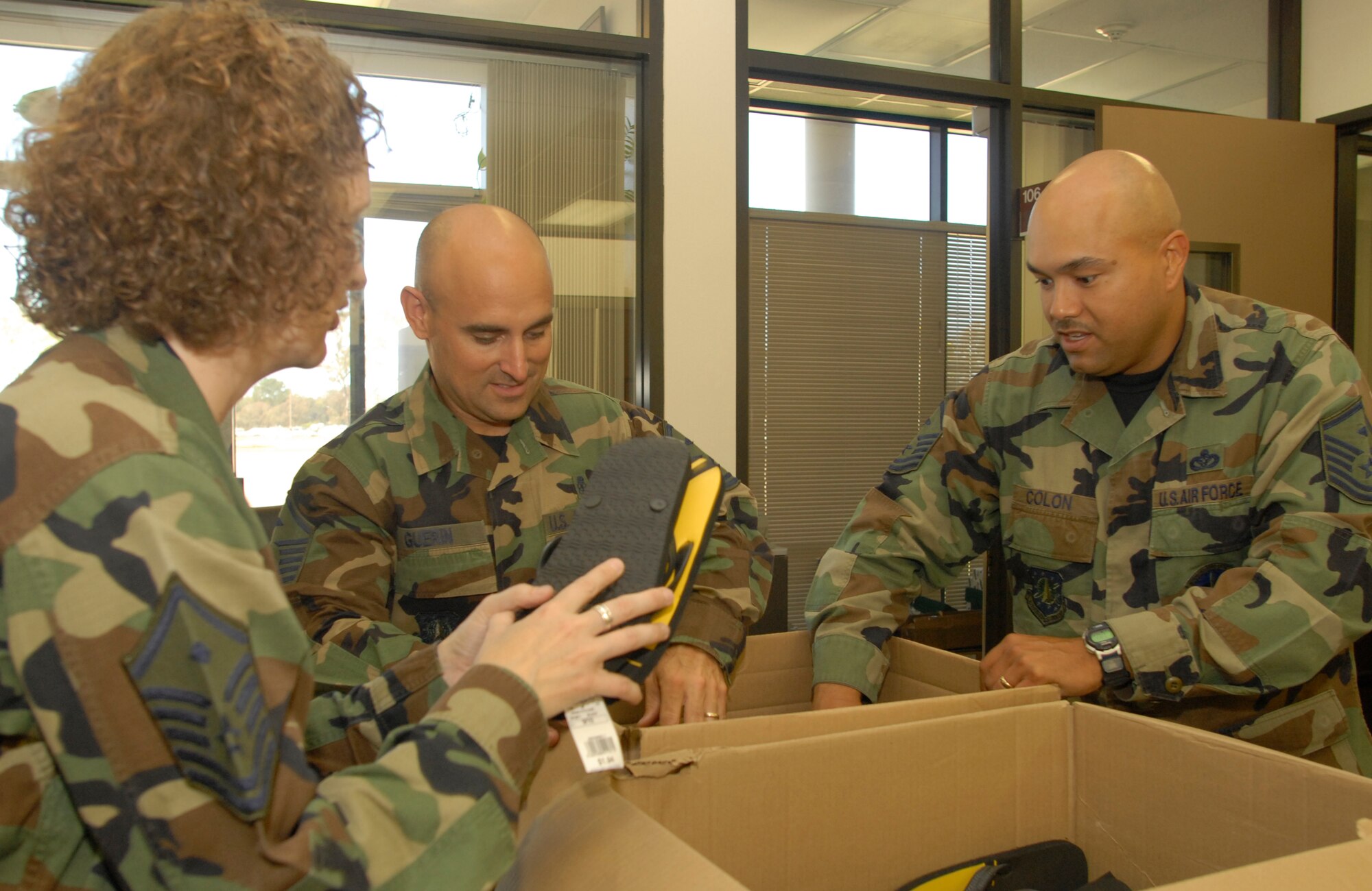 VANDENBERG AIR FORCE BASE, Calif. - Master Sgt. Angela Fernandez, 1st Sgt. for the 30th Medical Group, along with Master Sgt. Mark Guerin, 1st Sgt. for the 30th Logistic Readiness Squadron, and Master Sgt. Steven Colon, 1st Sgt. for the 576th Flight Test Squadron, prepare boxes on July 19 to be shipped to Iraq, part of Operation Warrior Comfort at the Logistic Readiness Squadron's Building. Operation Warrior Comfort provides support for the Contingency Air Staging Facility, or CSAF, that cares for sick and wounded Airmen and Soldiers transiting through on their way to Germany for care. The donations that have been fundraised through Operation Warrior Comfort will  provide some of the wounded troops with clothes since most of them arrive to the CASF with nothing but the clothes on their backs. (U.S. Air Force Photo by Senior Airman Kristi Emler)