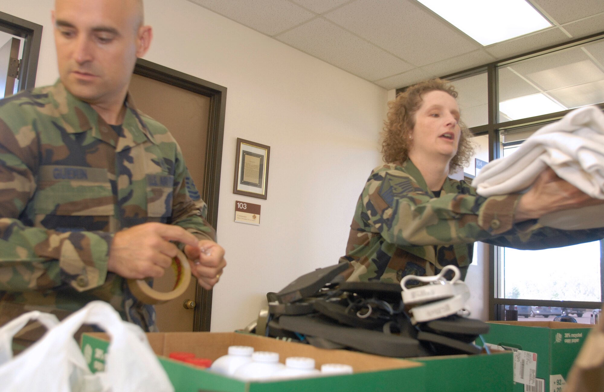 VANDENBERG AIR FORCE BASE, Calif. -- Master Sgt. Mark Guerin, 1st Sgt. for the 30th Logistic Readiness Squadron, along with Master Sgt. Angela Fernandez, 1st Sgt. for the 30th Medical Group, prepare boxes on July 19 to be shipped to Iraq, part of Operation Warrior Comfort at the Logistic Readiness Squadron's Building. Operation Warrior Comfort provides support for the Contingency Air Staging Facility, or CSAF, that cares for sick and wounded Airmen and Soldiers transiting through on their way to Germany for care. The donations that have been fundraised through Operation Warrior Comfort will  provide some of the wounded troops with clothes since most of them arrive to the CASF with nothing but the clothes on their backs. (U.S. Air Force Photo by Senior Airman Kristi Emler)