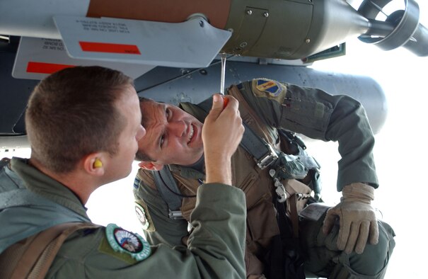 EIELSON AIR FORCE BASE, Alaska – Capt. Kevin Pritz watches his weapon systems officer, Capt. Chris Beery, during a pre-flight check of the F-15E Strike Eagle before a coalition mission here for Red Flag Alaska July 17. The jet and crew are deployed from the 335th Fighter Squadron from Seymour Johnson Air Force Base, N.C. (U.S. Air Force photo by Capt. Tana R.H. Stevenson)
