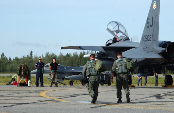 EIELSON AIR FORCE BASE, Alaska --Pilots step to their F-15E Strike Eagle for a coalition mission here during Red Flag Alaska July 17. The jets and crew are deployed from the 335th Fighter Squadron at Seymour Johnson Air Force Base, N.C. (U.S. Air Force photo by Capt. Tana R.H. Stevenson)