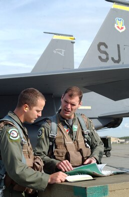 EIELSON AIR FORCE BASE, Alaska -- Capt. Kevin Pritz, 335th Fighter Squadron, Seymour Johnson Air Force Base, N.C., prepares for an F-15E Strike Eagle flight here during Red Flag Alaska July 17. This exercise provides unique opportunities to help integrate various forces into joint, coalition, and bilateral training from simulated forward operating bases. (U.S. Air Force photo by Capt. Tana R.H. Stevenson)