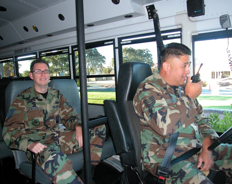Technical Sgt. Charles Torio checks-in with supervisor prior to departing the Westwind Inn, while fly-in reservist Technical Sgt. David Staggs looks on. (U.S. Air Force photo by TSgt Mary Beth Bemis)