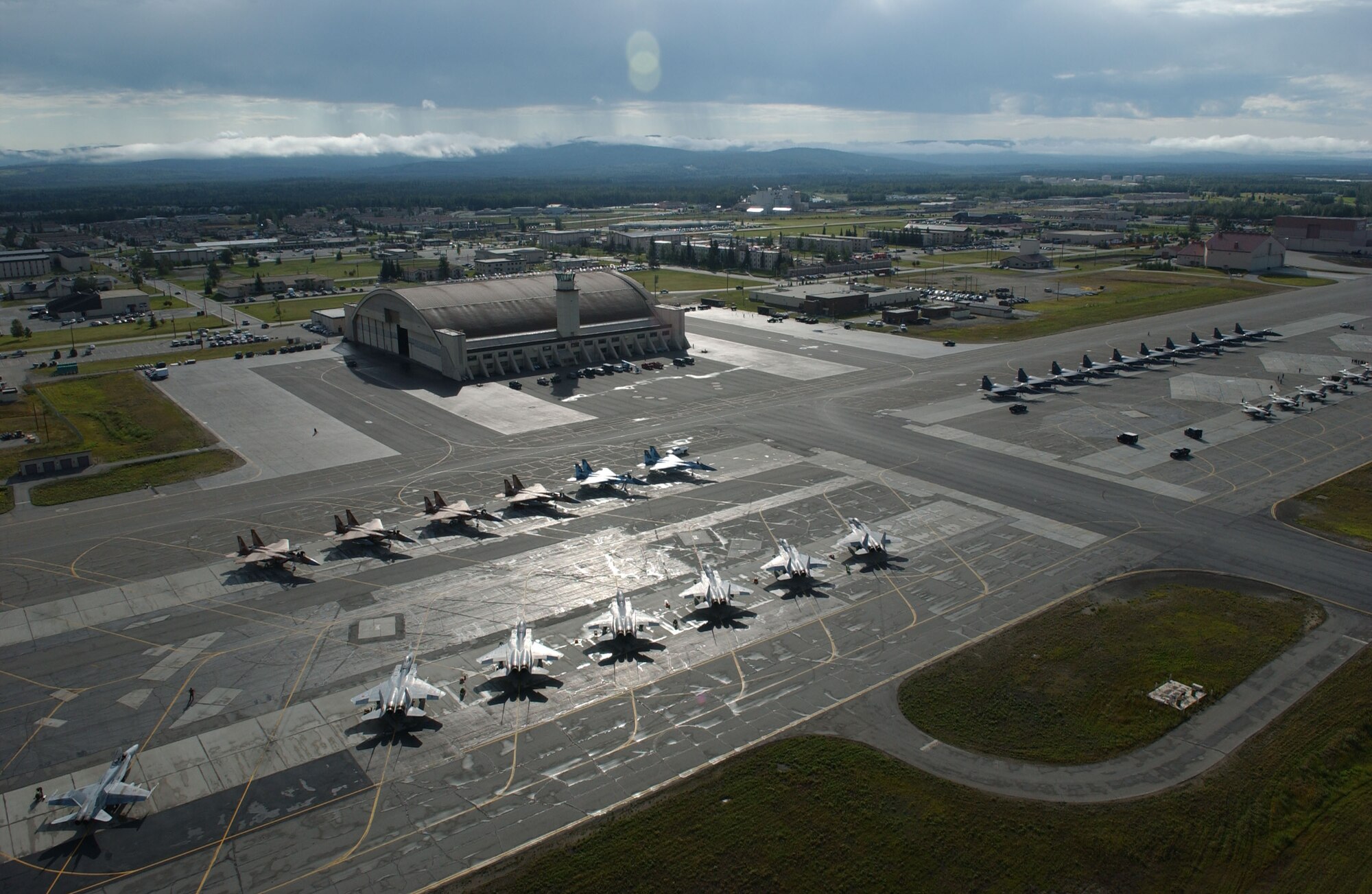 EIELSON AIR FORCE BASE, Alaska -- More than 60 aircraft line the flightline of Red Flag-Alaska 07-3 on July 18. This exercise provides joint offensive counter-air, interdiction, close air support, and large force employment training in a simulated combat environment.  These exercises are conducted on the Pacific Alaskan Range Complex with air operations flown out of Eielson and Elmendorf Air Force Bases. (U.S. Air Force Photo by Airman 1st Class Jonathan Snyder)