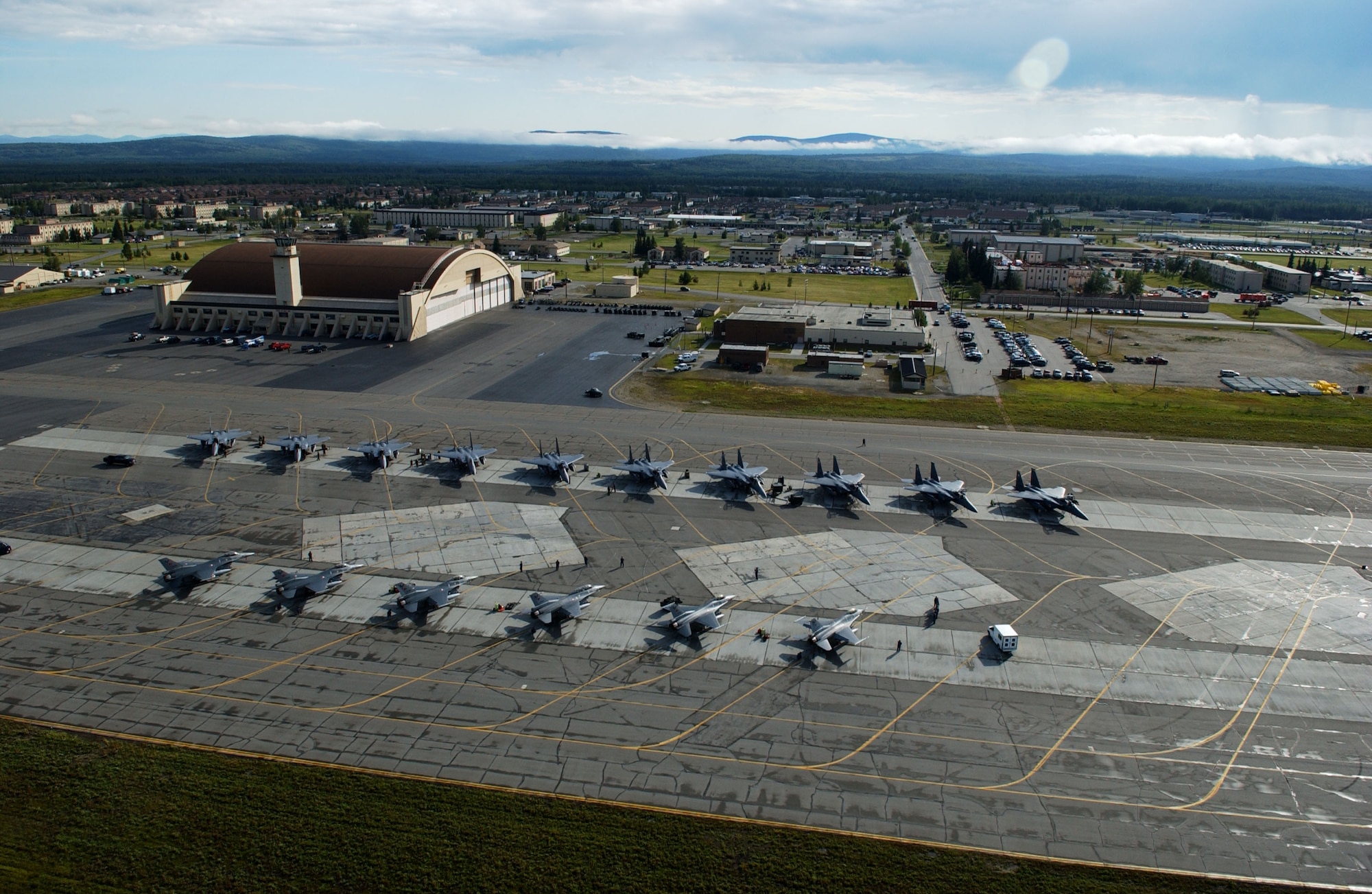EIELSON AIR FORCE BASE, Alaska -- More than 60 aircraft line the flightline of Red Flag-Alaska 07-3 on July 18. This exercise provides joint offensive counter-air, interdiction, close air support, and large force employment training in a simulated combat environment.  These exercises are conducted on the Pacific Alaskan Range Complex with air operations flown out of Eielson and Elmendorf Air Force Bases. (U.S. Air Force Photo by Airman 1st Class Jonathan Snyder)