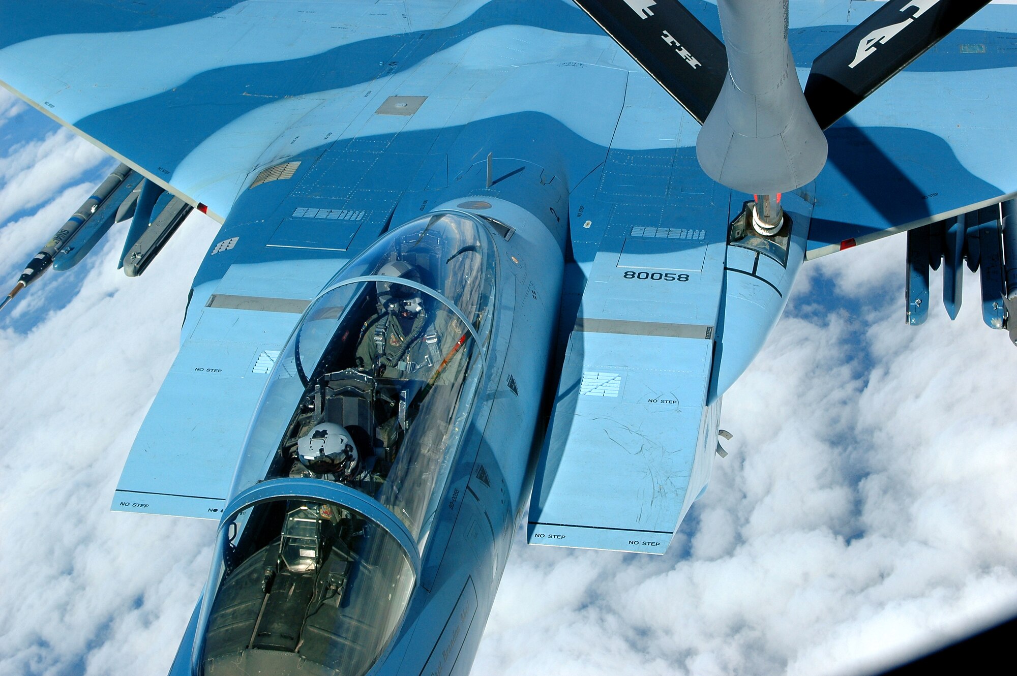 A KC-135 Stratotanker from the 434th Air Refueling Wing at Grissom Air Reserve Base, Ind., provides in-flight refueling to an F-15 Eagle from the 65th Aggressor Squadron over the Pacific Alaska Range Complex, during Red Flag-Alaska July 16. Red Flag-Alaska is a multinational air combat training exercise that began July 12 and will conclude July 28. (U.S. Air Force photo by Staff Sgt. Shawn J. Jones)
