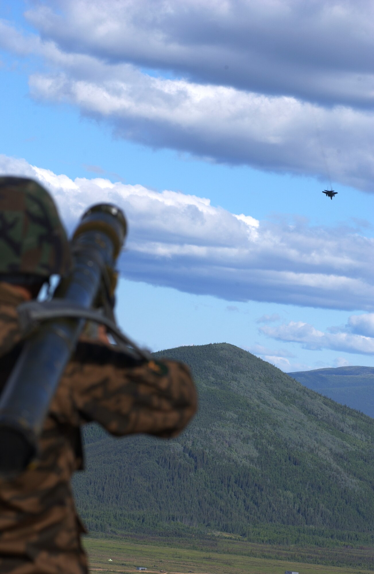 EIELSON AIR FORCE BASE, Alaska -- Staff Sgt. Munkhuu Batmunkh, Mongolian Air Defense Force, aims a SA-7 Man-portable air-defense systems (surface to air missile launcher) at an enemy aircraft on the Pacific Alaskan Range Complex on July 16 during Red Flag-Alaska 07-3. The PARC provides 67,000 square miles of airspace, one conventional bombing range and two tactical bombing ranges containing more than 400 different types of targets and more than 30 threat simulators which allows them to exchange tactics, techniques, and procedures and improve interoperability. (U.S. Air Force Photo by Airman 1st Class Jonathan Snyder) 