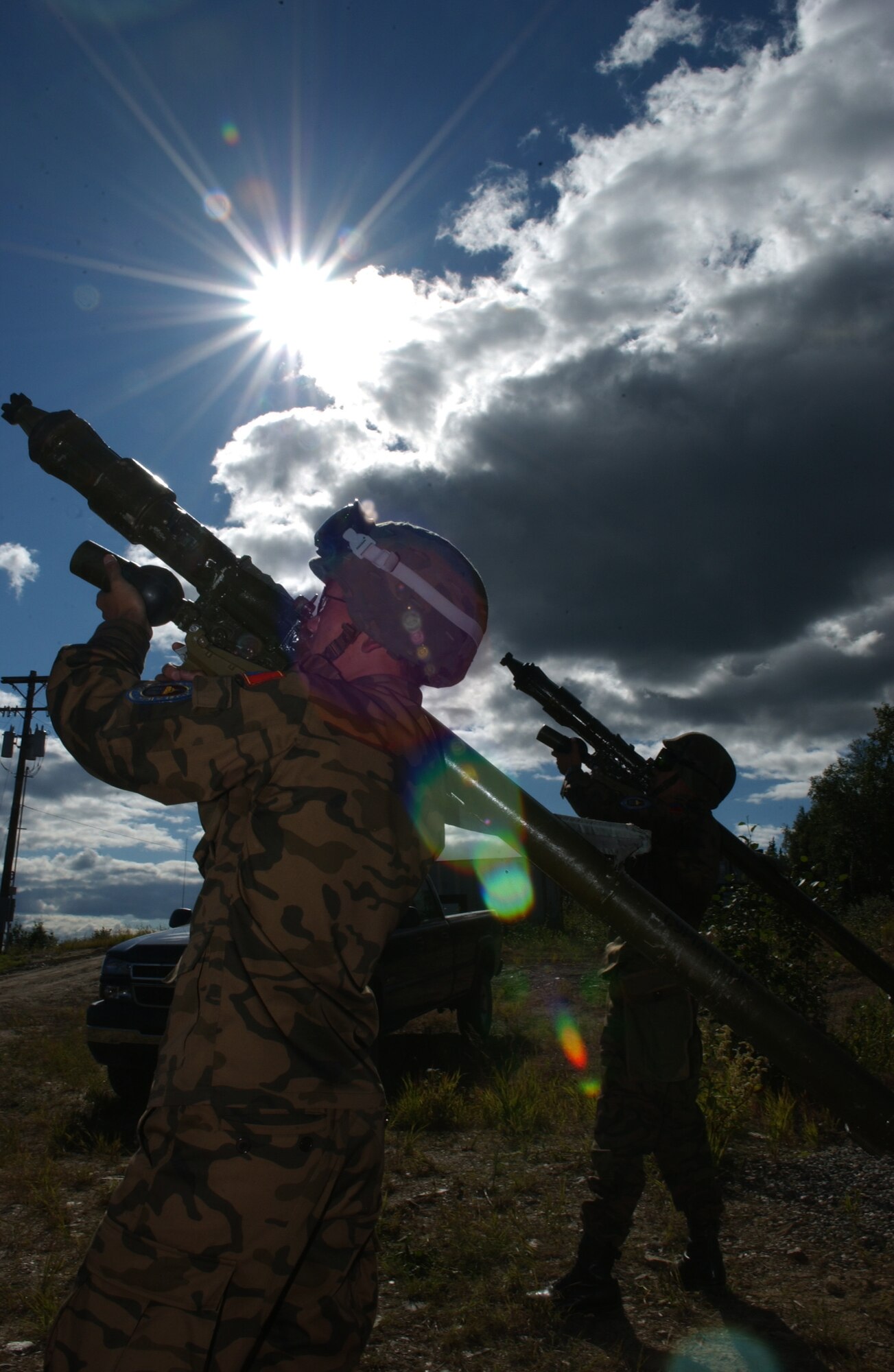 EIELSON AIR FORCE BASE, Alaska -- Staff Sgt. Munkhuu Batmunkh (Front), Sgt. Danaasuren Neggui (Back), Mongolian Air Defense Force, aims an SA-7 Man-portable air-defense systems (surface to air missile launcher) at an enemy aircraft on the Pacific Alaskan Range Complex on July 16 during Red Flag-Alaska 07-3. The PARC provides 67,000 square miles of airspace, one conventional bombing range and two tactical bombing ranges containing more than 400 different types of targets and more than 30 threat simulators which allows them to exchange tactics, techniques, and procedures and improve interoperability. (U.S. Air Force Photo by Airman 1st Class Jonathan Snyder) 