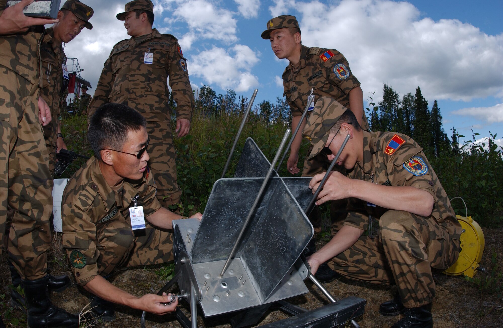 EIELSON AIR FORCE BASE, Alaska -- Airmen of the Mongolian Air Defense Force, set up a Smokey Sam ground to air missile launcher on the Pacific Alaskan Range Complex on July 16 during Red Flag-Alaska 07-3. The PARC provides 67,000 square miles of airspace, one conventional bombing range and two tactical bombing ranges containing more than 400 different types of targets and more than 30 threat simulators which allows them to exchange tactics, techniques, and procedures and improve interoperability. (U.S. Air Force Photo by Airman 1st Class Jonathan Snyder) 