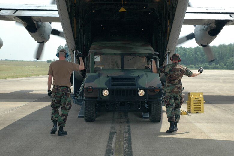 YOUNGSTOWN AIR RESERVE STATION, Ohio - Members of the 76th Aerial Port Squadron here practice an engines running offload of a HUMVEE July 18 in preparation for the Air Mobility Rodeo 2007 competion.  U.S. Air Force photo/Tech. Sgt. Bob Barko Jr.