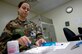 Staff Sgt. Josie Maple, pharmaceutical technician with the 437th Medical Group, counts pills for a prescription in the Charleston AFB pharmacy Tuesday.  (U.S. Air Force photo/Airman 1st Class Nicholas Pilch) 
