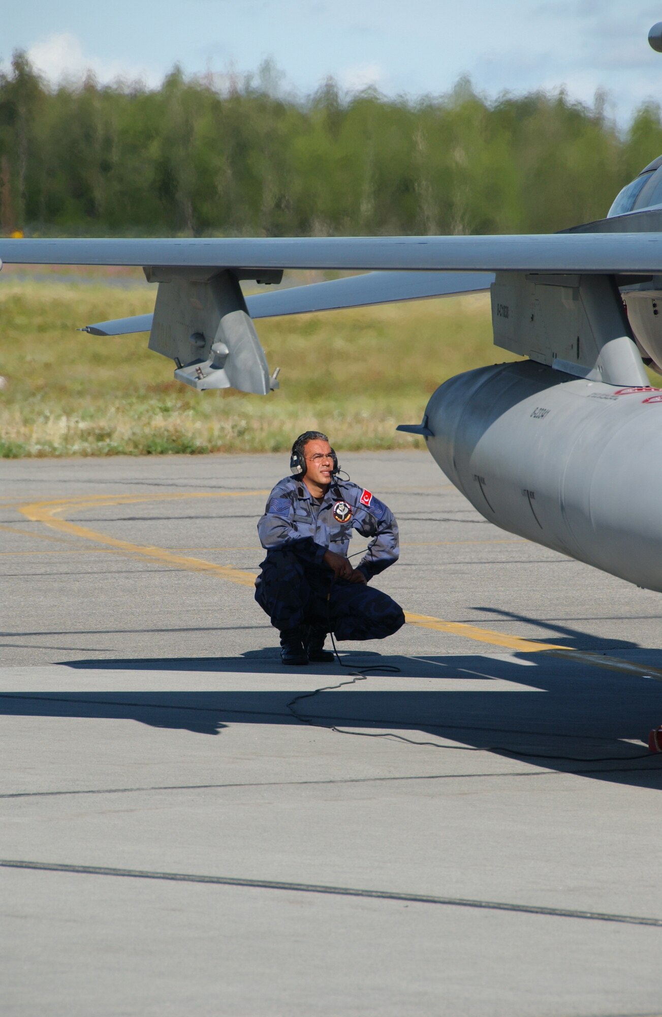 EIELSON AIR FORCE BASE, Alaska -- Master Sgt. Adnan Akpinar, Turkish Air Force goes through a pre-flight inspection on a Turkish F-16 July 16, 2007. Red Flag-Alaska, a series of Pacific Air Forces commander-directed field training exercises for U.S. forces, provides joint offensive counter-air, interdiction, close air support, and large force employment training in a simulated combat environment. (U.S. Air Force photo by Airman 1st Class Christopher Griffin) 
