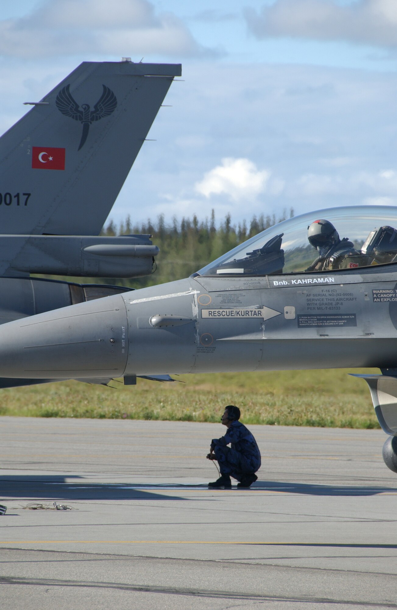 EIELSON AIR FORCE BASE, Alaska -- A Turkish Air Force crew chief goes through a pre-flight check before the pilot takes off for his first exercise in Red Flag-Alaska, July 16, 2007. These exercises are conducted on the Pacific Alaskan Range Complex with air operations flown out of Eielson and Elmendorf Air Force bases in Alaska. (U.S. Air Force photo by Airman 1st Class Christopher Griffin) 