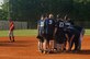 The 437th Logistics Readiness Squadron softball team kicks dirt over the pitcher's mound until it's covered in celebration of their win against the 437th Civil Engineer Squadron 15-10 on base Monday. (U.S. Air Force Photo/Staff Sgt. April Quintanilla)