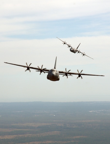 Two of the Air Force's newest airlifters, the C-130J Super Hercules aircraft, fly in formation during a training mission. The delivery of the fourth and final aircraft to the Royal Norwegian Air Force comes 60 days earlier than projected.  (U.S. Air Force photo/Maj. Chad Gibson) 