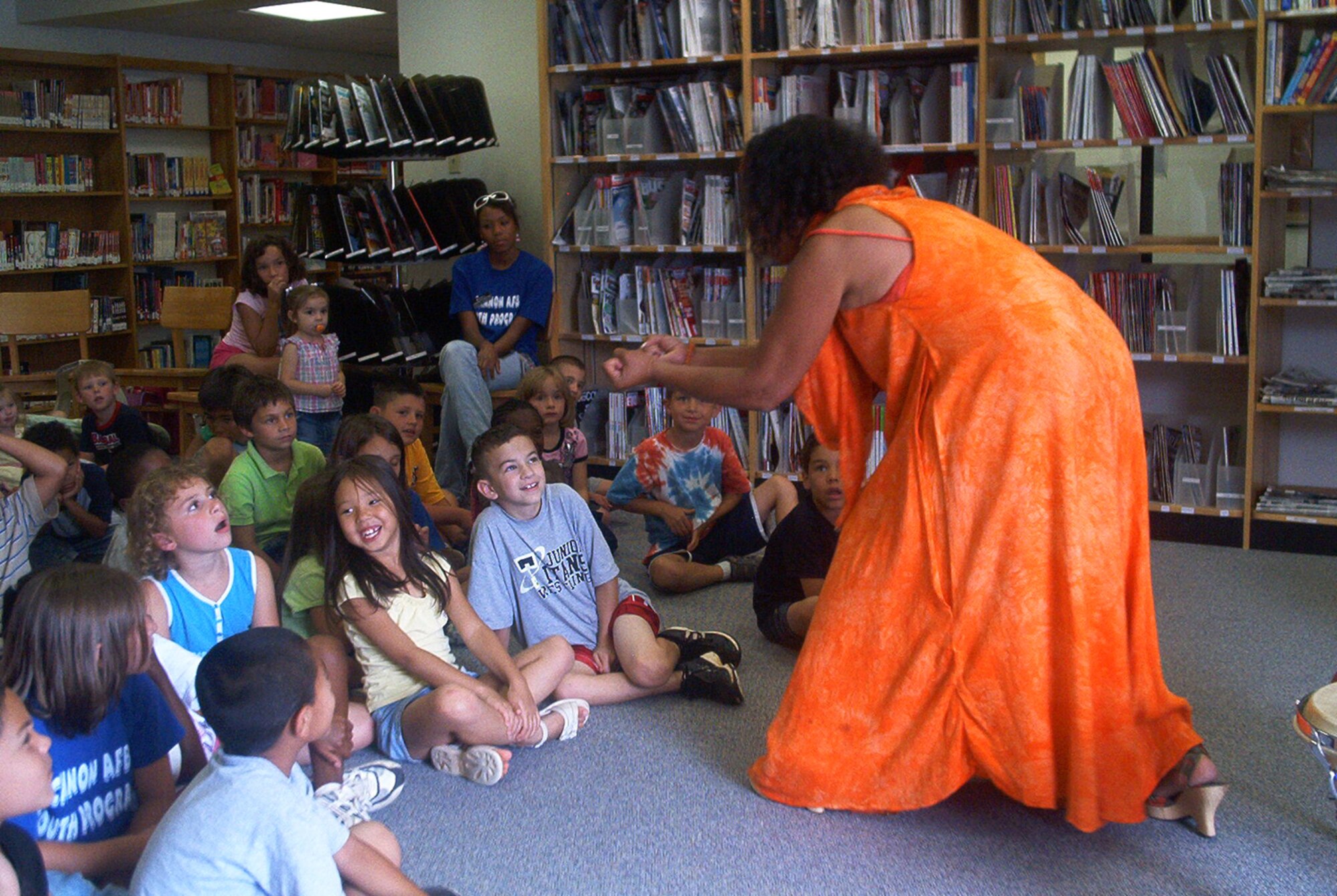 CANNON AIR FORCE BASE, N.M. -- Brenda Holllingsworth-Picket captures the attention of children with her "Beat of the Wild" presentation on July 12 during the summer reading program. On July 19 the Albuquerque Bio Park will be at the Cannon Library with a presentation of live birds and small animals at 10:30 and 11 a.m. For more information, call 784-2786.  (Courtesy photo)