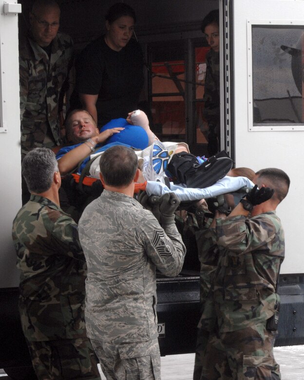 Chief Master Sgt. of the Air Force Rodney J. McKinley and members of the 435th Aerospace Medicine Squadron help load a patient going onto an aeromedical evacuation flight July 10 at Ramstein Air Base, Germany. Chief McKinley followed patients through Landstuhl Regional Medical Center to the Contingency Areomedical Staging Facility and finally on the flight back to the states. (U.S. Air Force photo/Airman 1st Class Kenny Holston)
