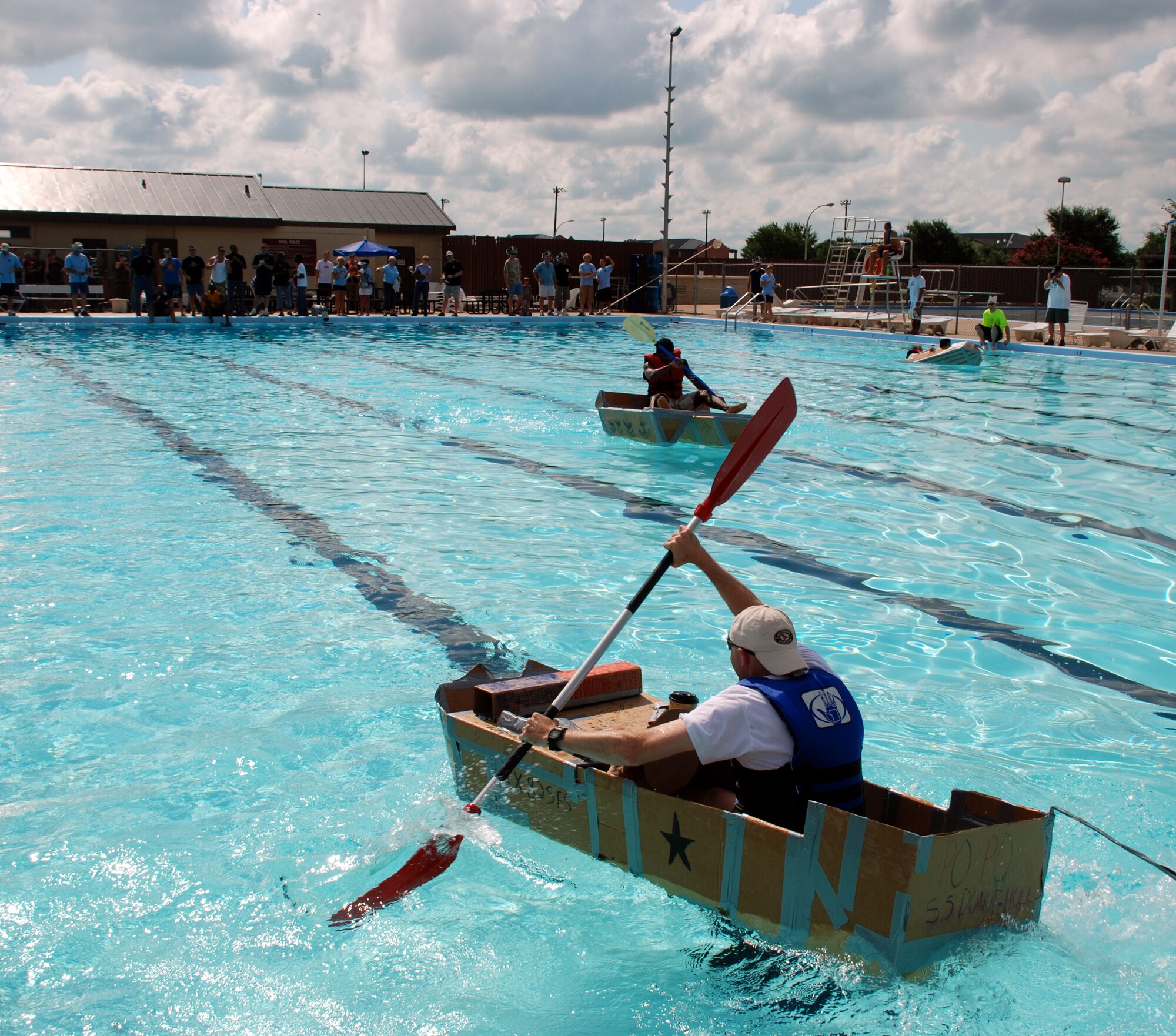 Maj. Gregory Nowak 82nd Security Forces Squadron commander, races toward the "finish line" at the Build-a-Boat Race July 14 at the main pool. (U.S. Air Force photo/Airman 1st Class Jacob Corbin)