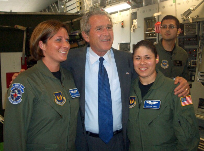 President George W. Bush thanks Staff Sergeants Chassidy Dority and Raelene Amaya for their service to their country July 10 after flying a mission from Ramstein Air Base, Germany, to Andrews Air Force Base, Md. The two NCOs are assigned to the 86th Aeromedical Evacuation Squadron. (U.S. Air Force photo/Master Sgt. Phillip Gettins)
