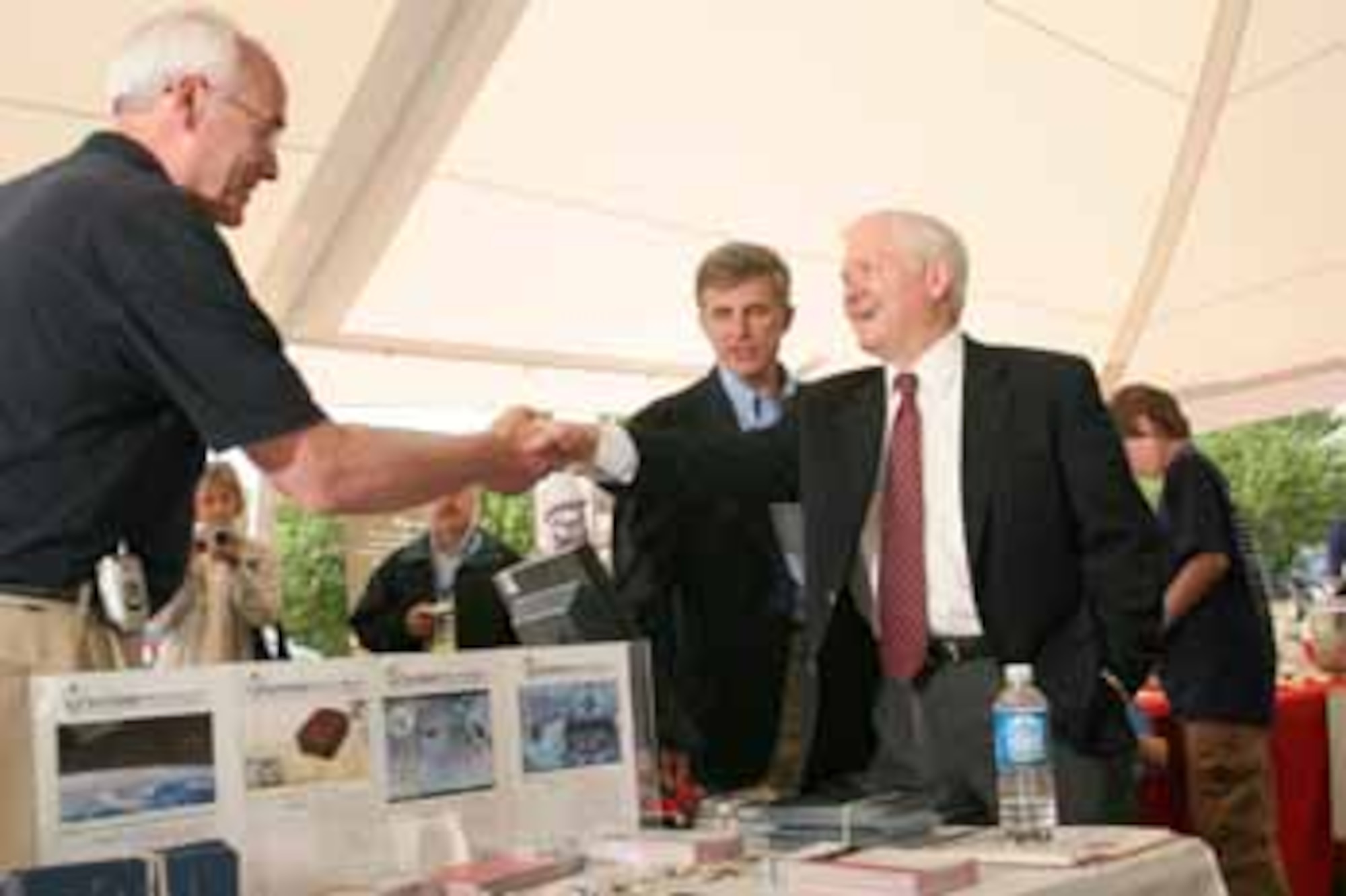 Secretary of Defense Robert Gates is introduced to AFOSR University Nanosatellites program manager, Dr. Kent Miller by Undersecretary of the Air Force Dr. Ron Sega at the Team America Rocketry Challenge. (Photo by Mike Zinski for Aerospace Industries Associat